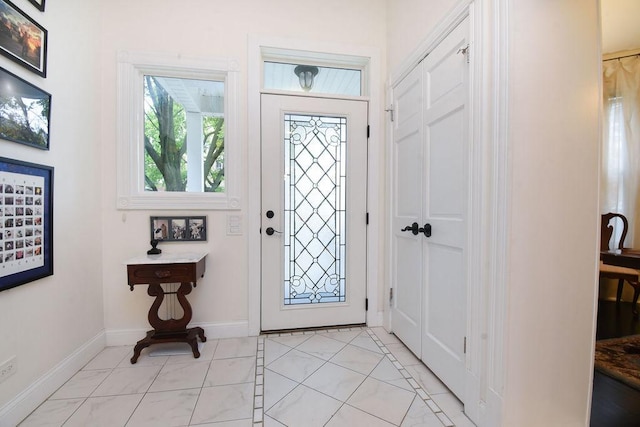 entryway featuring light tile patterned floors