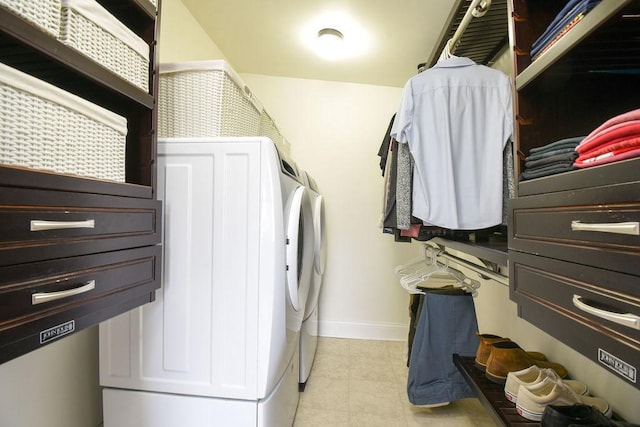 clothes washing area with separate washer and dryer