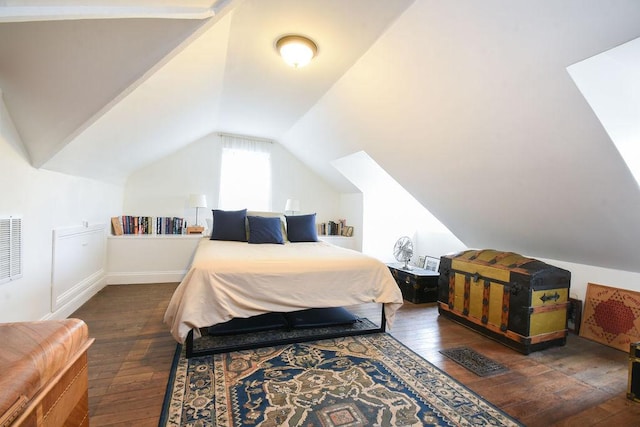 bedroom with dark wood-type flooring and lofted ceiling