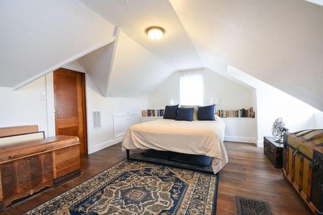 bedroom featuring vaulted ceiling and dark hardwood / wood-style floors