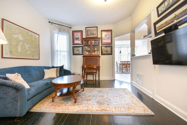 living room featuring dark hardwood / wood-style floors