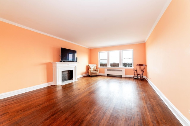 unfurnished living room with crown molding and wood-type flooring