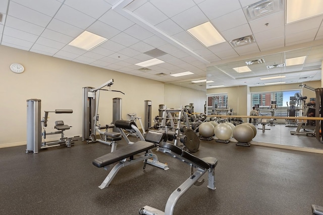 exercise room with a drop ceiling