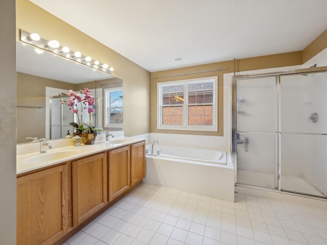 bathroom featuring independent shower and bath, vanity, and tile patterned flooring