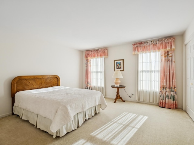 bedroom with light carpet