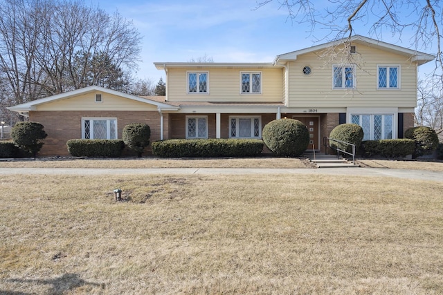 front facade with a front lawn