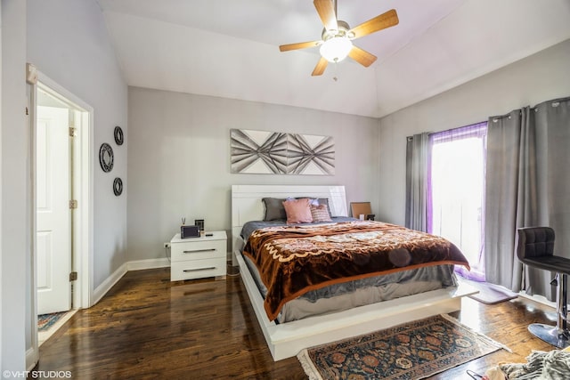 bedroom with dark wood-type flooring, ceiling fan, and vaulted ceiling