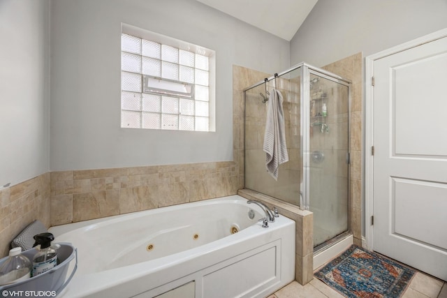 bathroom with lofted ceiling, plus walk in shower, and tile patterned flooring