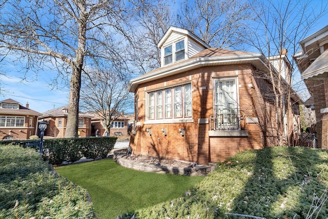 view of property exterior featuring a lawn