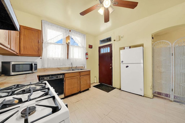 kitchen with tasteful backsplash, sink, exhaust hood, ceiling fan, and white appliances