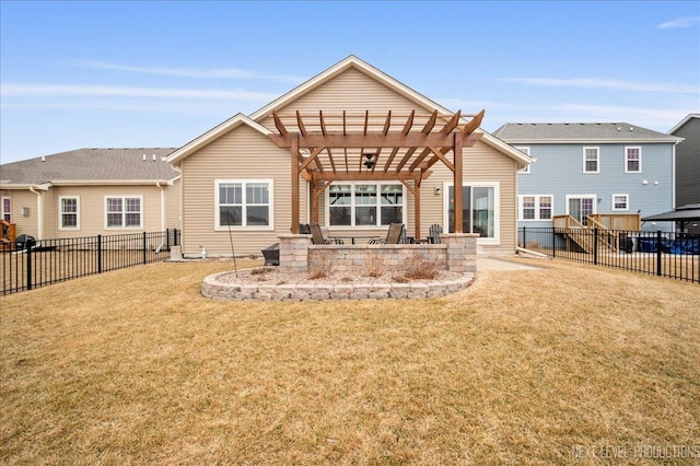 back of property featuring a yard and a pergola