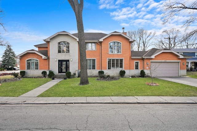 view of property with a garage and a front lawn