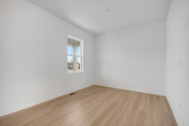 empty room with light hardwood / wood-style floors