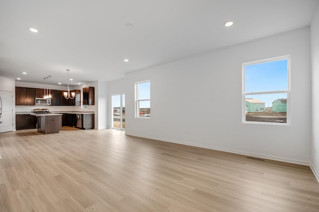 unfurnished living room with light hardwood / wood-style floors