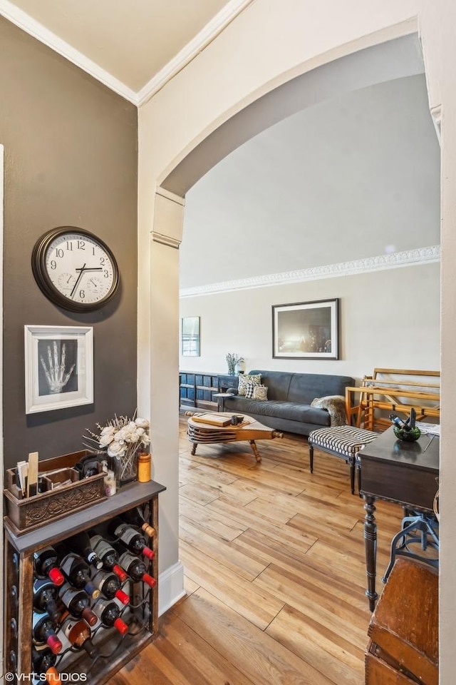 interior space featuring ornamental molding and hardwood / wood-style floors