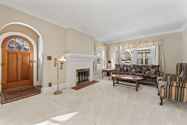 carpeted living room featuring a fireplace and crown molding