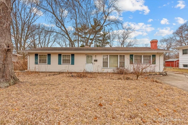 ranch-style house with a chimney