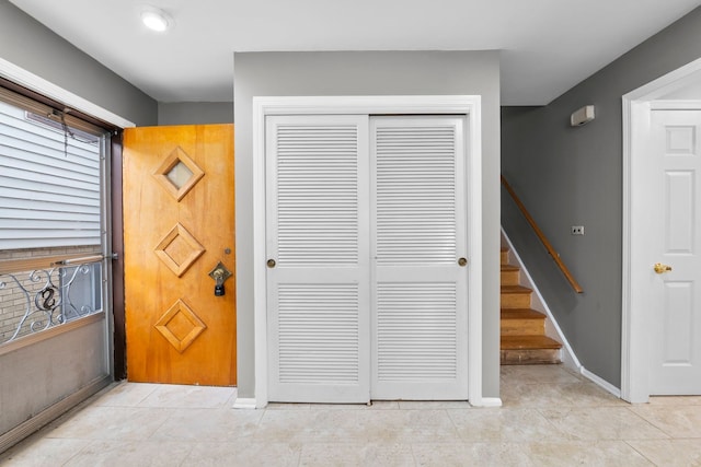 tiled foyer featuring a healthy amount of sunlight