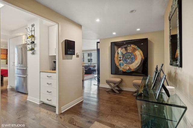 hallway with dark wood-type flooring