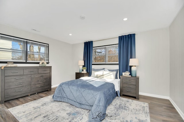 bedroom featuring dark hardwood / wood-style flooring