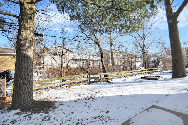 view of yard layered in snow