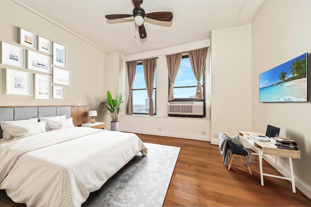 bedroom featuring cooling unit and wood-type flooring