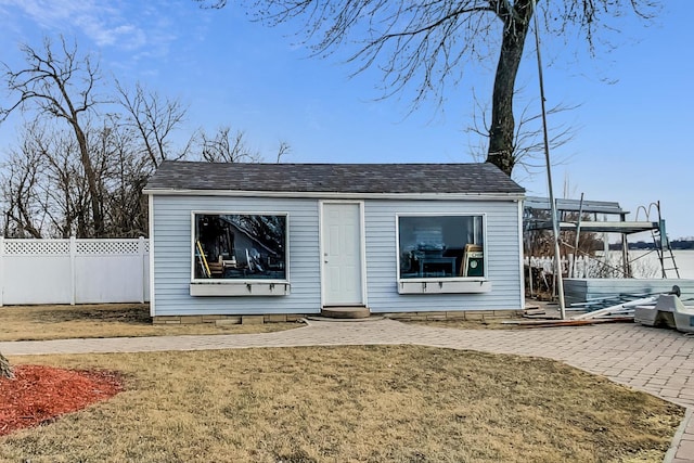 view of outbuilding with a yard