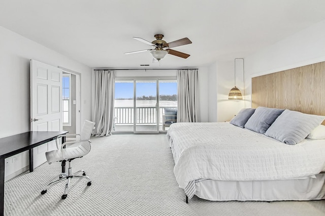 bedroom with ceiling fan, access to exterior, and carpet