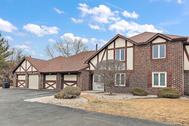 english style home with a garage