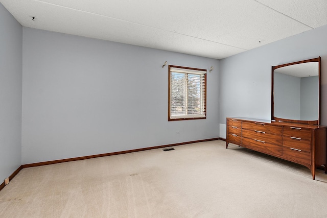 unfurnished bedroom featuring light colored carpet