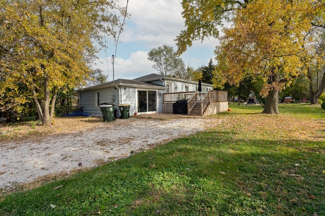 exterior space with a yard and a deck