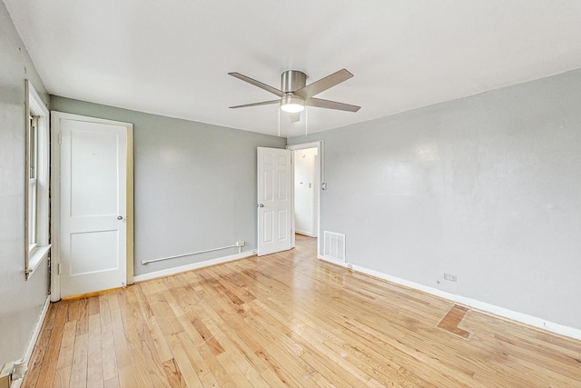 spare room with ceiling fan and light hardwood / wood-style floors