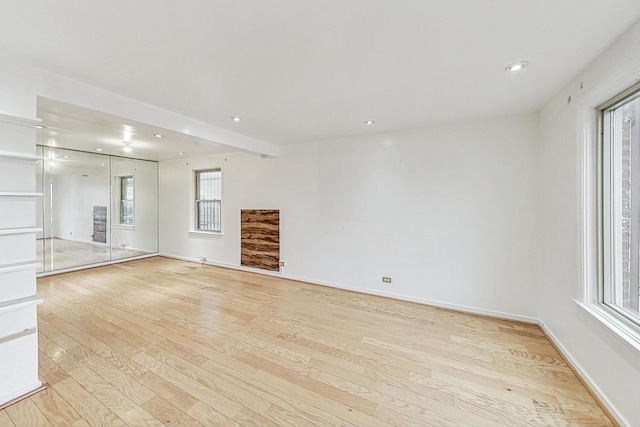 unfurnished living room with light hardwood / wood-style floors