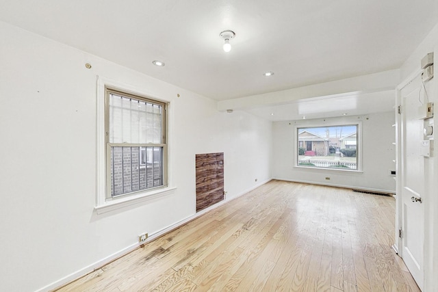 unfurnished living room with light hardwood / wood-style flooring