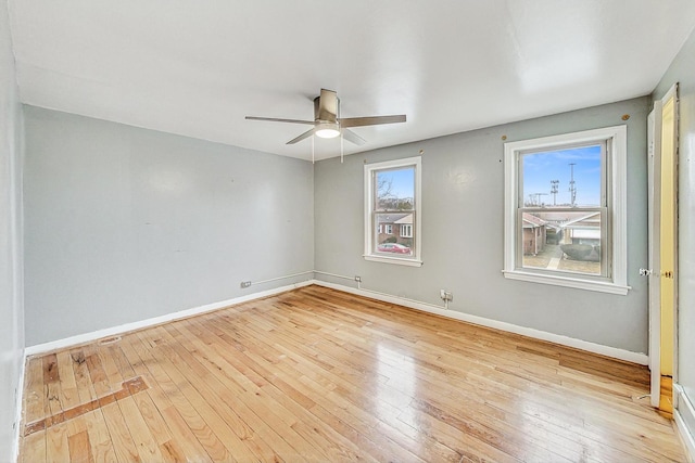 unfurnished room with light hardwood / wood-style flooring and ceiling fan