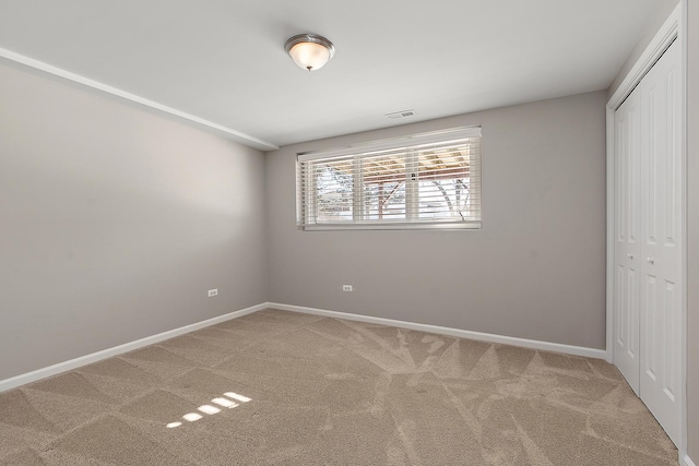 unfurnished bedroom with carpet floors and a closet