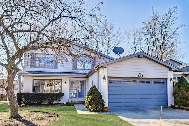 view of front of house with a garage and a front yard