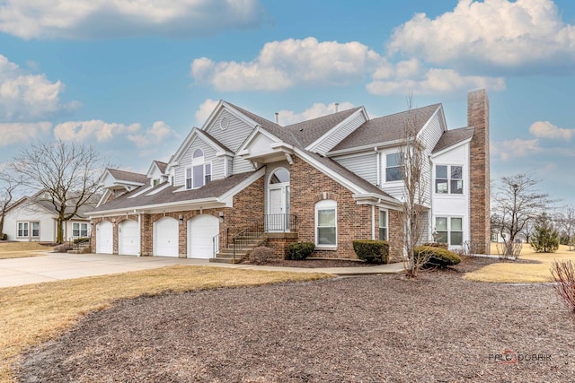 view of front of home with concrete driveway and brick siding