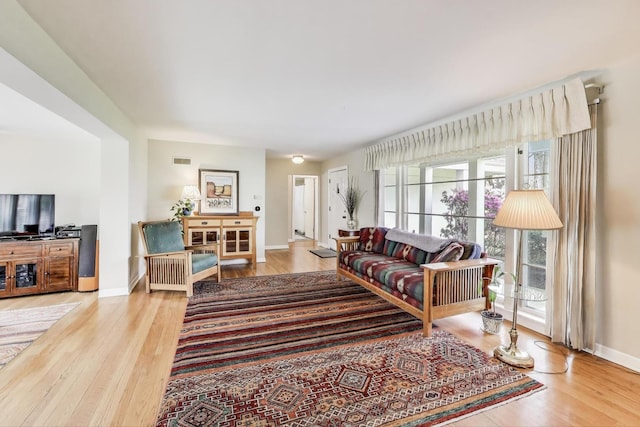 201 W Council Trl, Mount Prospect, IL 60056 - living room featuring baseboards, wood finished floors, and visible vents