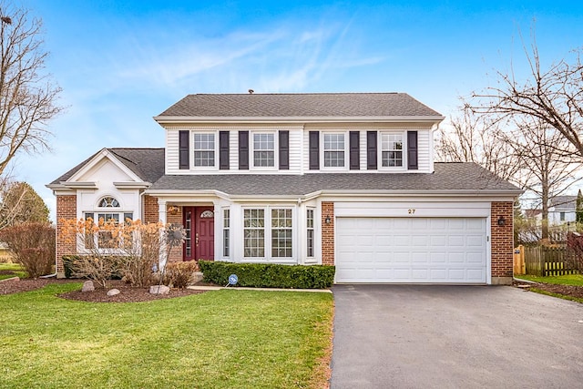 front facade with a garage and a front lawn