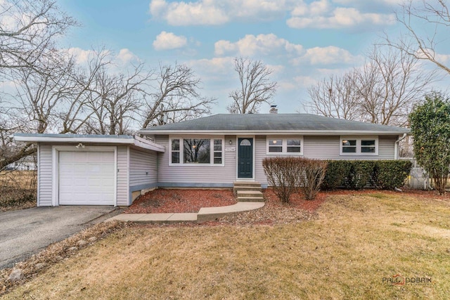 single story home featuring a garage and a front lawn