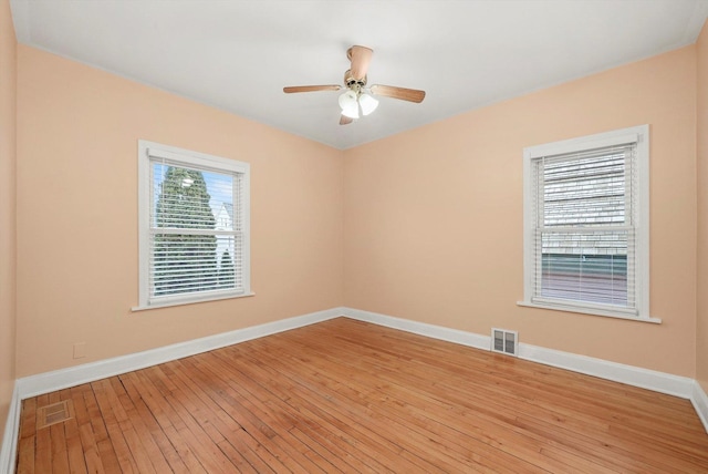 spare room featuring ceiling fan and light wood-type flooring