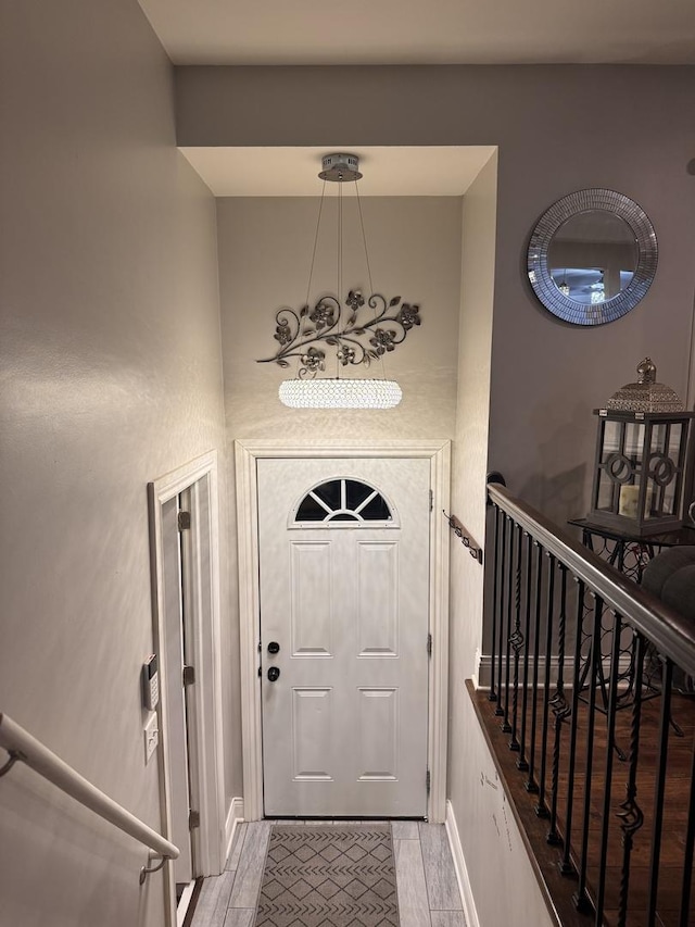 entryway with light wood-style flooring and stairway