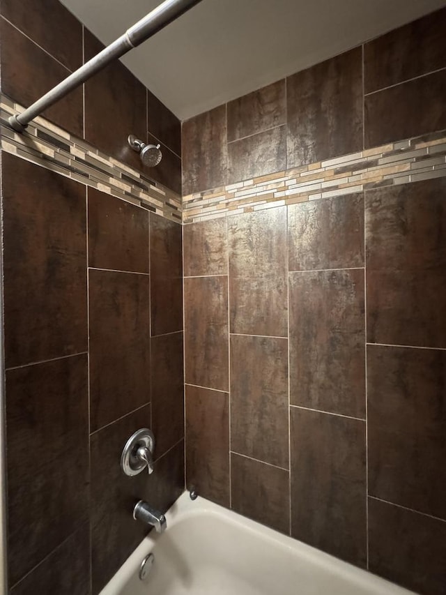 bathroom featuring washtub / shower combination