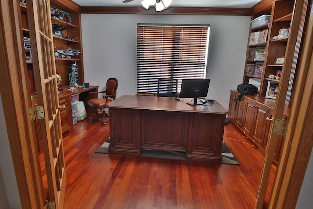 office area with crown molding, dark wood-type flooring, and ceiling fan