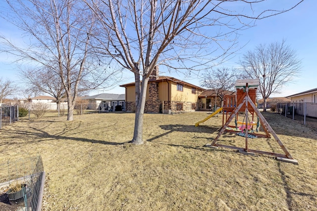 exterior space featuring a yard and fence