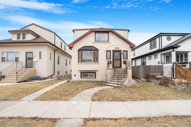 view of front of home with a front lawn