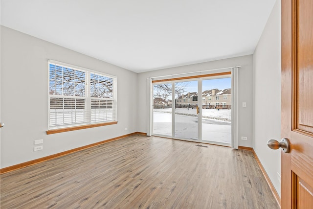 empty room featuring light hardwood / wood-style floors