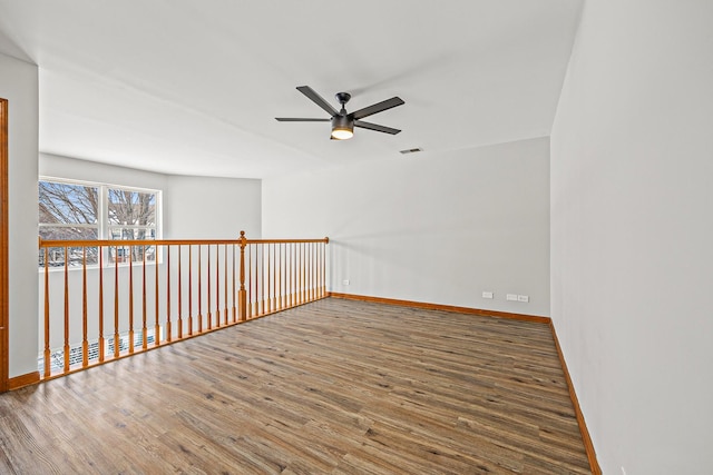 unfurnished room featuring ceiling fan and wood-type flooring