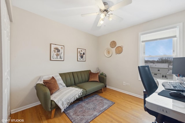 office space featuring light hardwood / wood-style flooring and ceiling fan